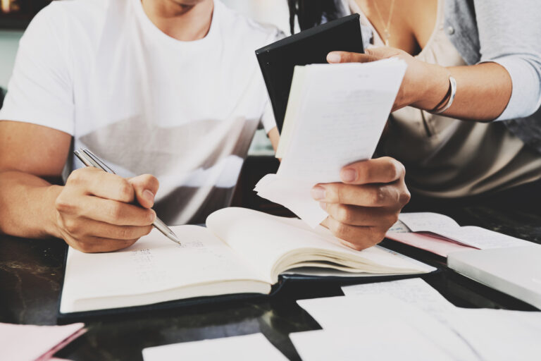 Couple working with paperas